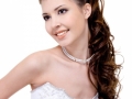 smiling bride with curly wedding hairstyle